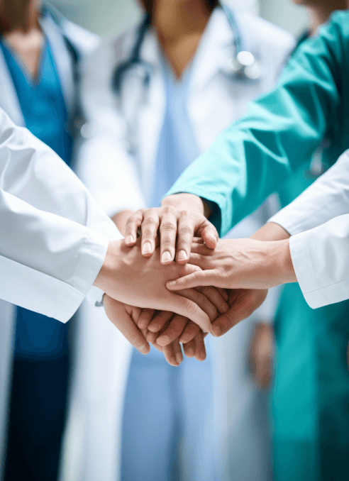 medical professionals joining hands